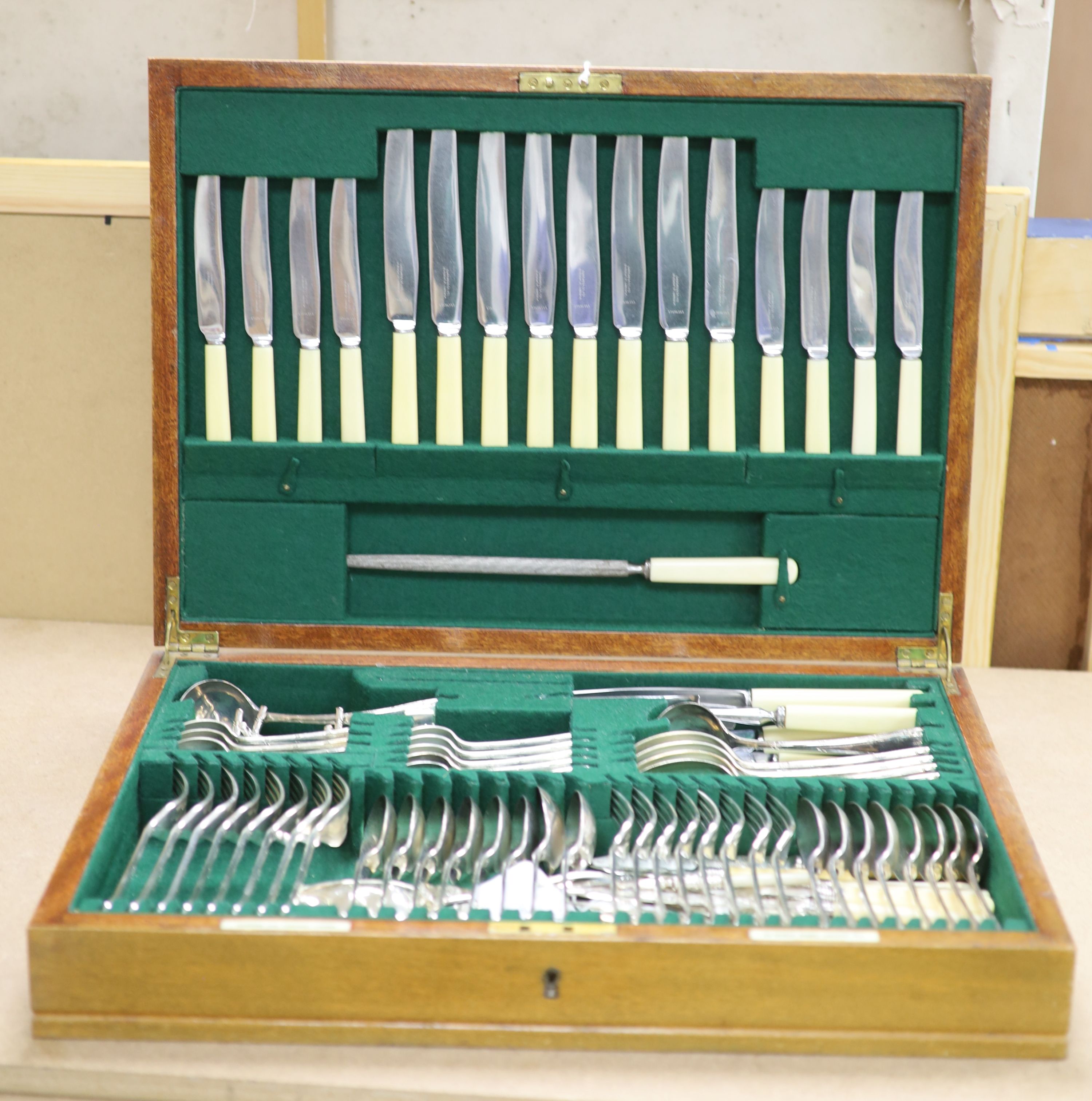 A Garrard & Co service of plated flatware in mahogany canteen, a pair of plated bottle coasters and a plated tray